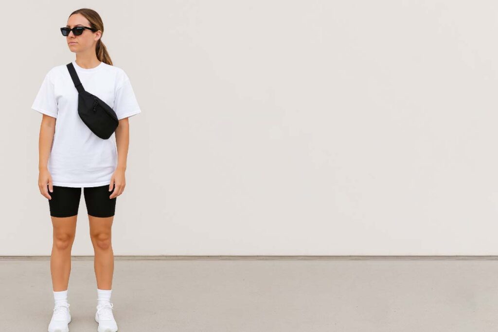 black bike shorts and white tee with crossbody belt bag